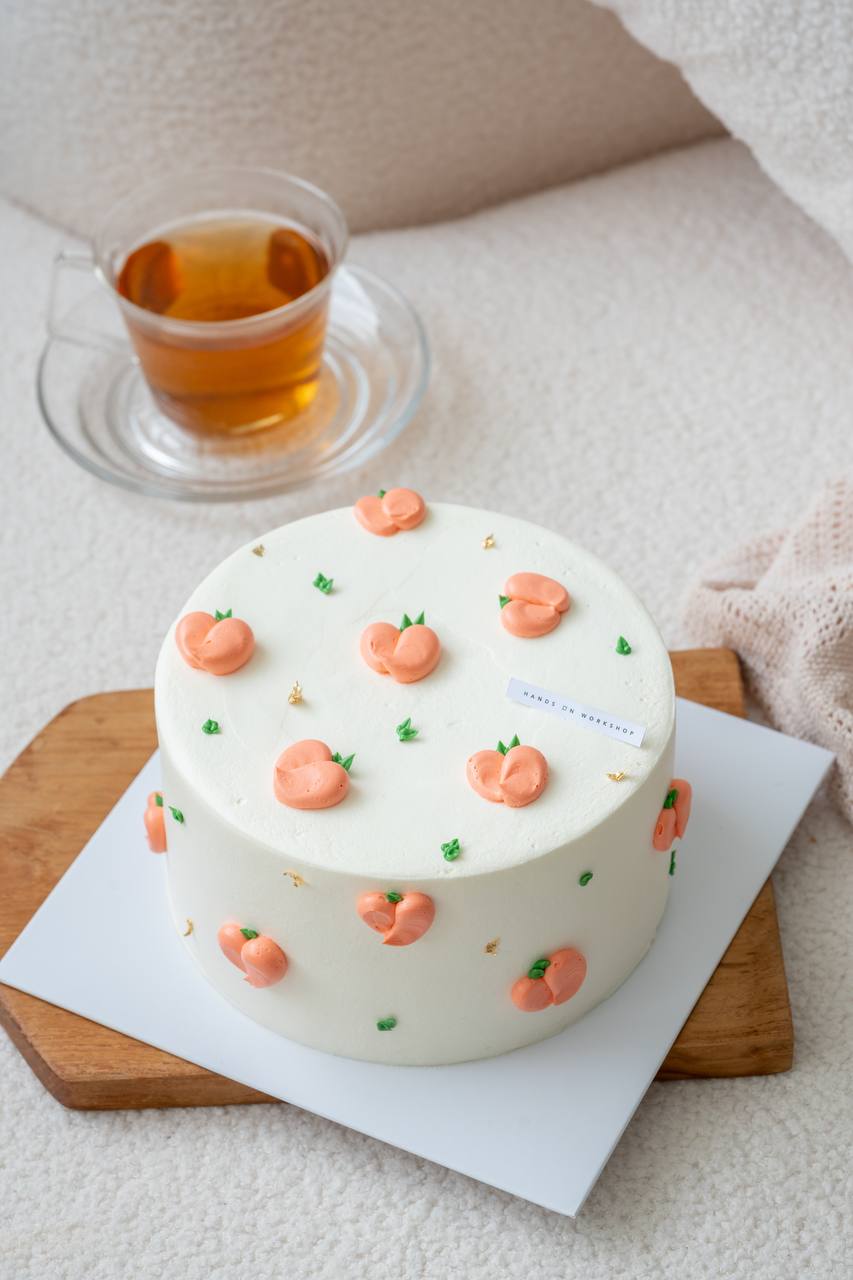 Three Tone Floral Cake on Peach Color Base Cake - Pink Apron